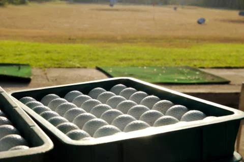 Bucket of practice golf balls Stock Photos