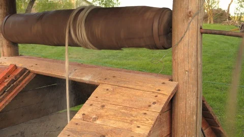 Bucket quickly falls down the well, the rope uncoils Stock Footage 89606172