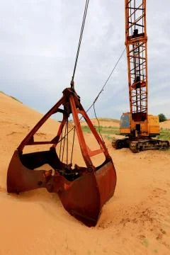 Bucket in sand Stock Photos