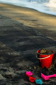 Bucket in the sand Stock Photos
