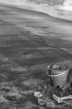 Bucket in the sand Stock Photos