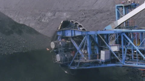 Bucket wheel excavator mining coal in open pit quarry Stock Footage 330210906