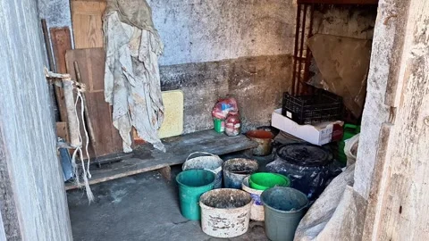 Buckets and Bags in Rustic Utility Room with Concrete Floor Stock Footage 330846711
