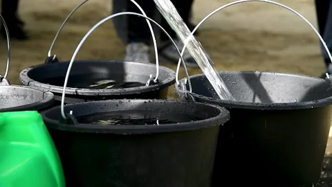 Buckets are filled with water Stock Footage 253666450