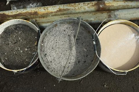 Buckets of ashes. Ash in jar. Ashes in container. Stock Photos