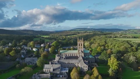 Buckfast Abbey from  a drone at evening sun, Totnes, Devon, England, Europe Stock-Footage 253758482