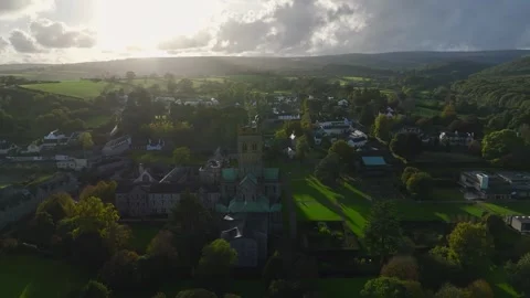 Buckfast Abbey from  a drone at evening sun, Totnes, Devon, England, Europe Stock-Footage 253758541