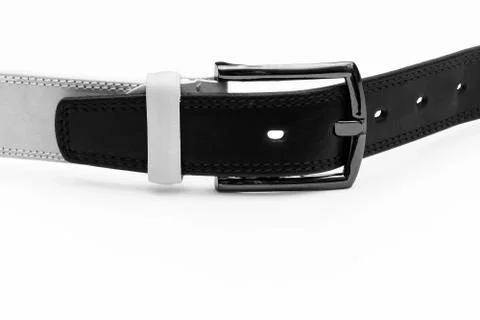 In the buckle of the light belt is inserted a black leather belt 写真素材