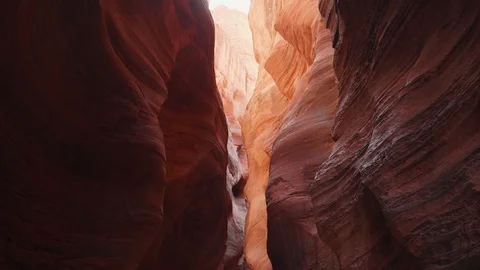 Buckskin Gulch Deep Slot Canyon With Wavy And Smooth Orange Red Rock Walls Stock Footage