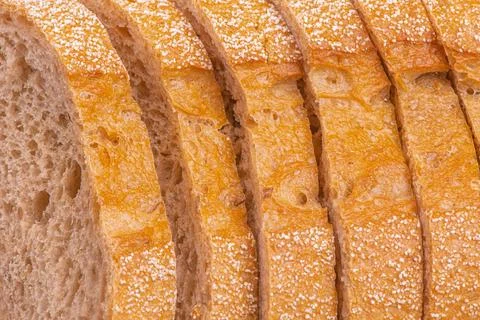 Buckwheat bread cut into pieces as a background. Stock Photos