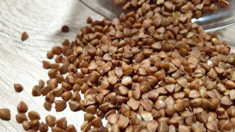 Buckwheat. Buckwheat kernels. Buckwheat close-up. Dietary grits. Video stock 119127676