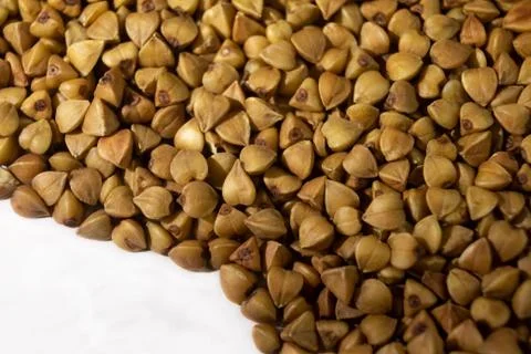 Buckwheat close-up on a white background, texture Stock Photos