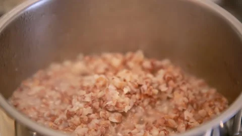 Buckwheat is cooked in a saucepan Stock Footage 146753786