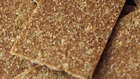 Buckwheat diet breads spinning on black, healthy rye flour meals, healthy food Stock Footage 160945677