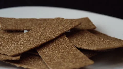 Buckwheat diet breads spinning on black, healthy rye flour meals, healthy food Stock Footage 164874477