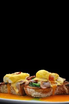 Buckwheat Eggs Benedict With Bacon Stock Photos