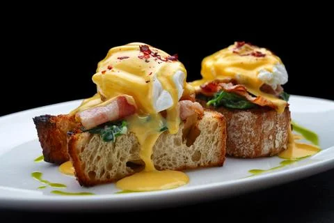 Buckwheat Eggs Benedict With Bacon Stock Photos