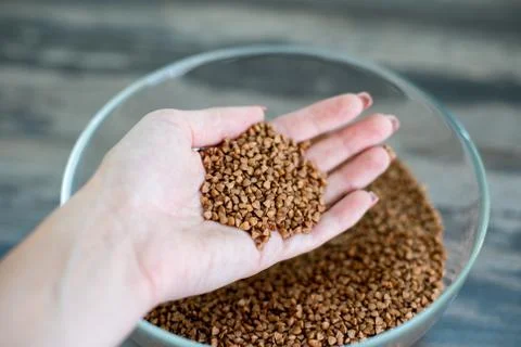 Buckwheat in a glass container Stock Photos