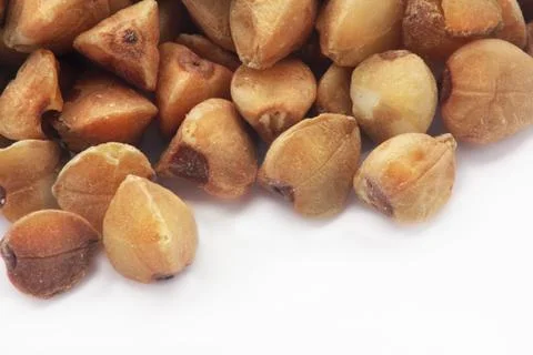 Buckwheat grains on a white background Stock Photos