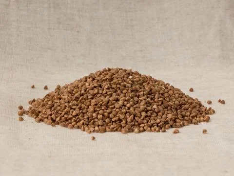 Buckwheat on the linen background Stock Photos