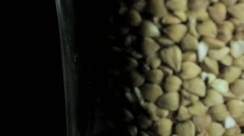 Buckwheat, macro on dark background in a glass Video stock 61246317
