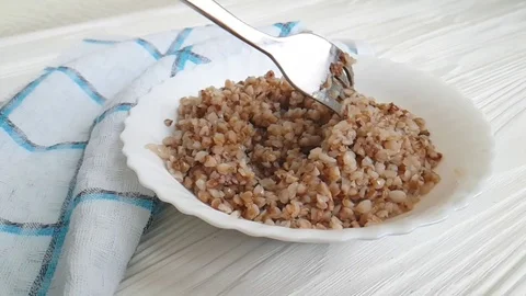 Buckwheat porridge on a table, fork Stock Footage 87652899