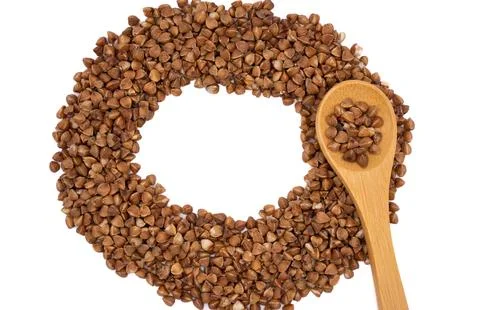 Buckwheat Ring Composition with Wooden Spoon Stock Photos