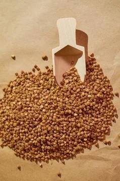 Buckwheat is scattered on the table close up Stock Photos