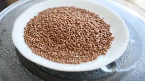 The buckwheat spins in a plate Stock Footage 136364666