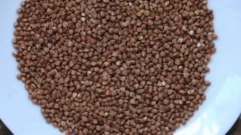 The buckwheat spins in a plate Stock Footage 136364831