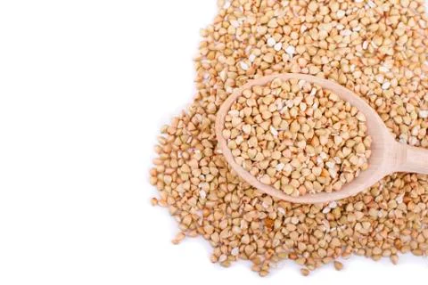 Buckwheat in spoon isolated on white background Stock Photos