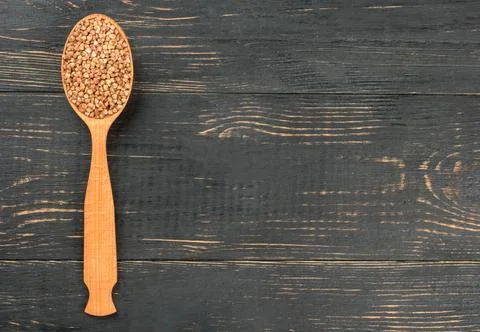 Buckwheat in spoonful Stock Photos