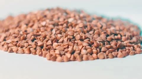 Buckwheat on the white background Stock Footage 60133907