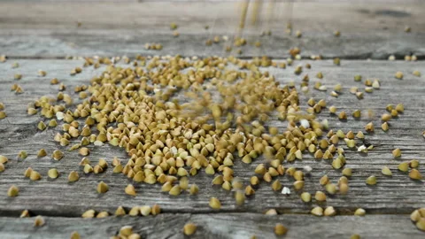 Buckwheeat falling on a wooden table 動画素材 155390719