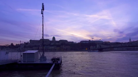 Budapest Danubes sunset with Royal Castle, Chain Bridge and a floating dock Stock Footage 79719974