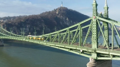 Budapest, Hungary - 4K drone flying by Liberty Bridge and yellow tram Stock Footage 121507408