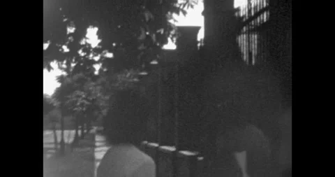 Budapest, Hungary - circa 1970s: Classic 8mm film shot of a stylish young woman, Vidéo 339655865