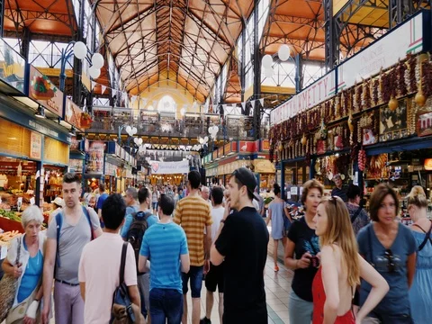 Budapest, Hungary, June 2017: Visitors walk around The central market in Stock Footage 76823631