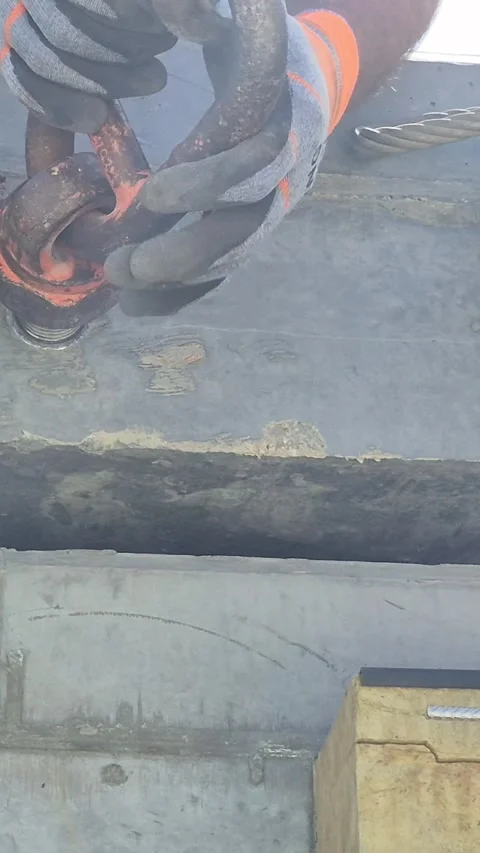 Budapest, Hungary - May 2026: Vertical shot of worker preparing concrete slab Stock Footage 337563203