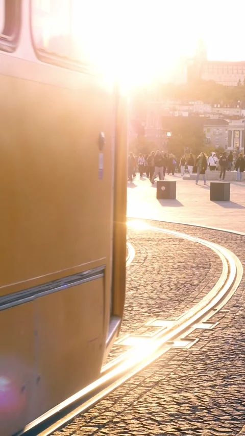 Budapest, October 18, 2025. Yellow tram passing in front of the Parliament Vídeos de archivo 334775189
