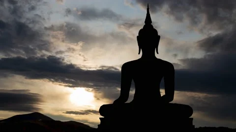 Buddah: Time Lapse at Sunrise with Fast Clouds and Dark Silhouette of Statue Stock Footage 134258215