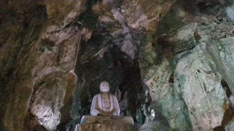 Buddha and deity inside a cave in the Marble Mountains Vietnam Stock Footage 313486713