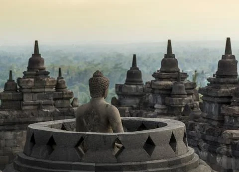 Buddha and rooftops, The Buddhist Temple of Borobudur, Java, Indonesia Stock Photos
