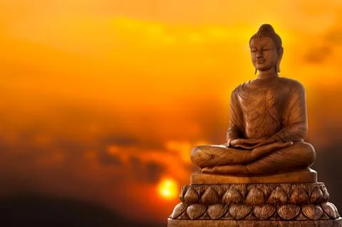 Buddha and sunset Stock Photos