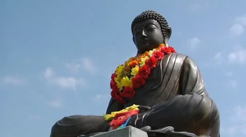 Buddha on a background of clouds Stock Footage 12278782