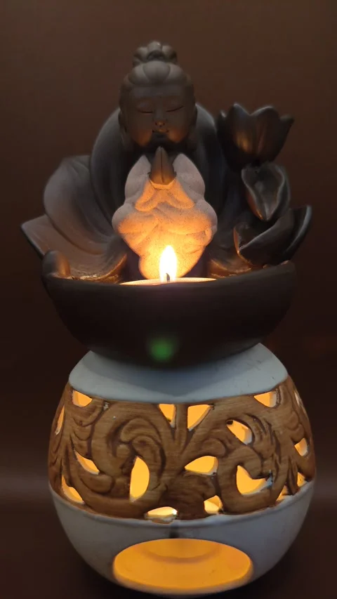 Buddha candlestick with candle composition Stock Footage 330310561