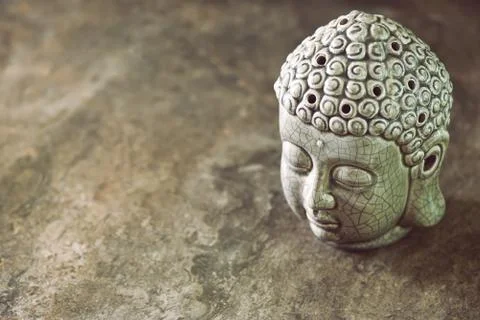 Buddha head statue background with a space for a text Stock Photos