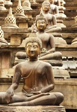 Buddha in lotus position Stock Photos