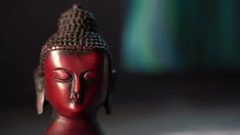 Buddha red Idol face mediating with indoor background Stock Footage 136594122