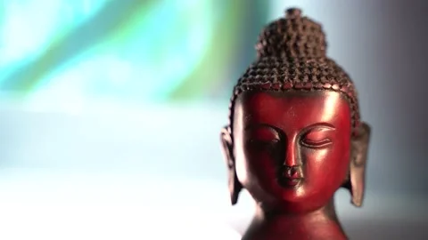 Buddha red Idol face mediating with wind and sunshine Stock Footage 136594833